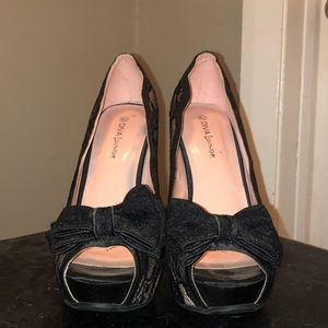 Black high heels with lace and bow